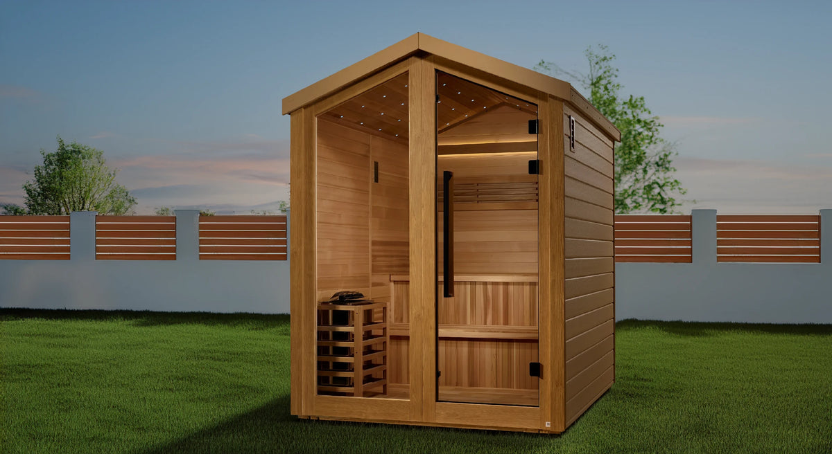 Golden Designs Kaarina model traditional steam sauna with star galaxy overhead lighting made from Canadian red cedar interior and an all weather composite exterior with a 6 person capacity built for outdoor use on a green lawn in a large backyard